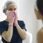 Woman in Blue Scrub Suit Feeling Happy, plastic surgery in turkey
