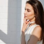Woman in White Top Posing for Picture, facial