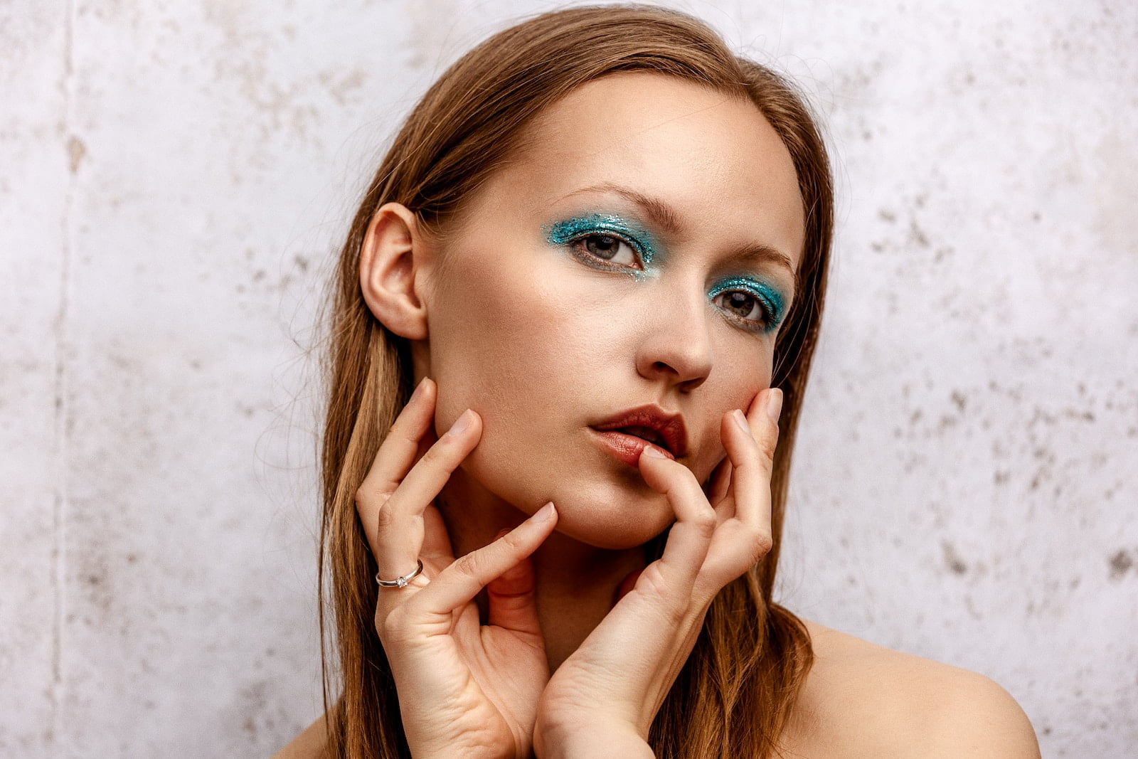 woman with red lipstick and blue eyes, facial feminization surgery