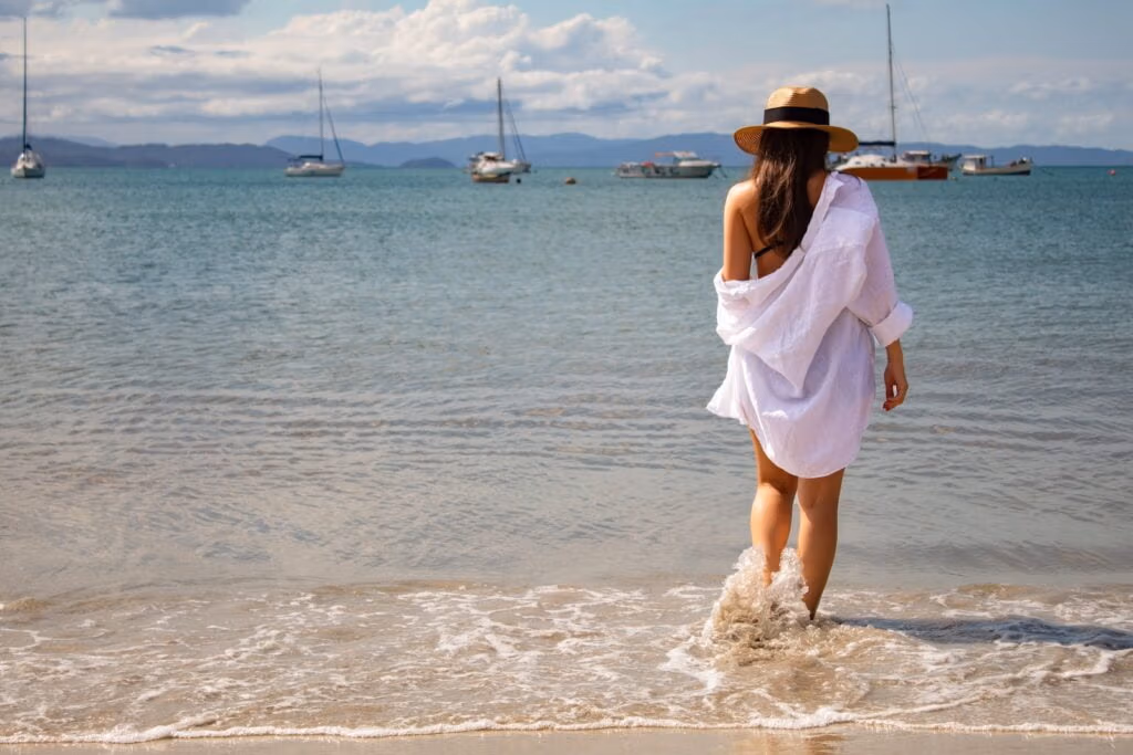 woman in white dress standing on beach during daytime, The Benefits of Hair Transplant in Antalya for Women