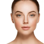 Close-up portrait of a woman with smooth skin, defined eyebrows, and a neutral expression, set against a plain white background.