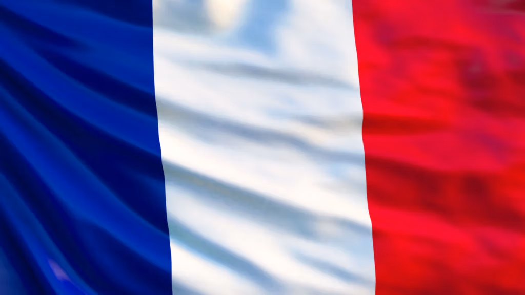 A waving French flag with vibrant blue, white, and red vertical stripes, symbolizing national pride and identity.