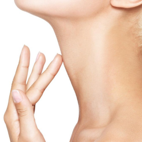 A close-up image of a woman's neck and hand. The woman is gently touching her neck with her fingertips, possibly checking for signs of aging or skin condition. The focus is on the smoothness and texture of the skin, highlighting the neck area.